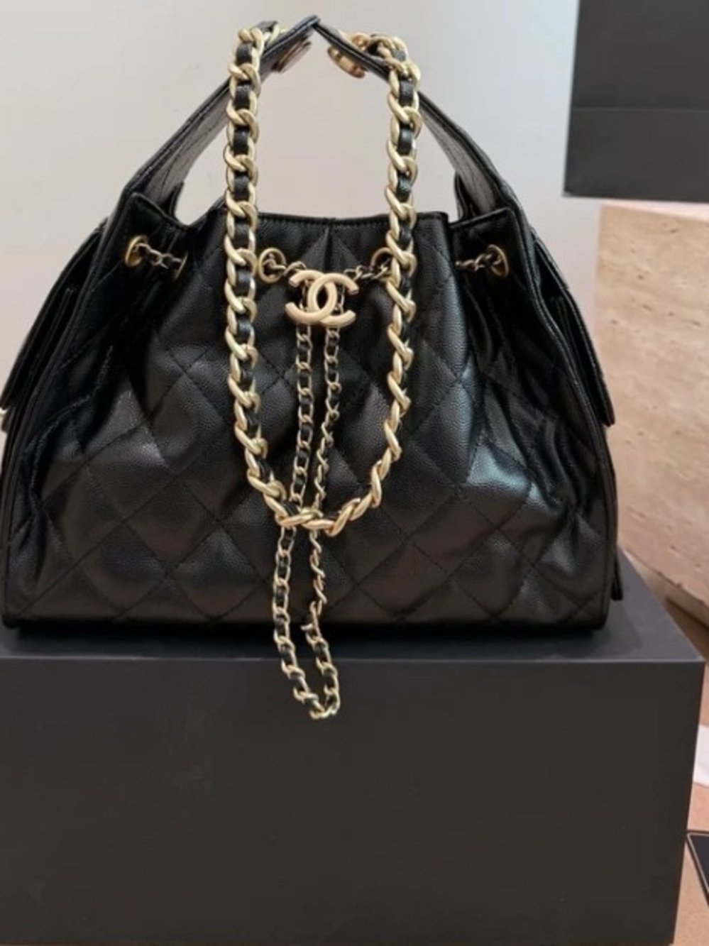 CHANEL Black Quilted Leather Drawstring Shoulder Bag with Gold Chain